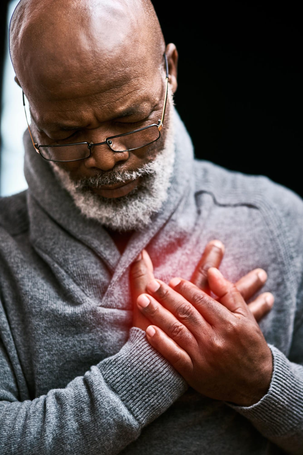man with chest and heart pain