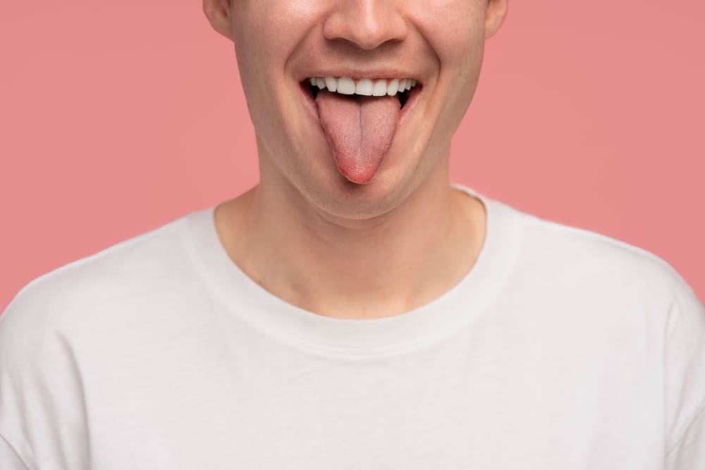 man sticking tongue out