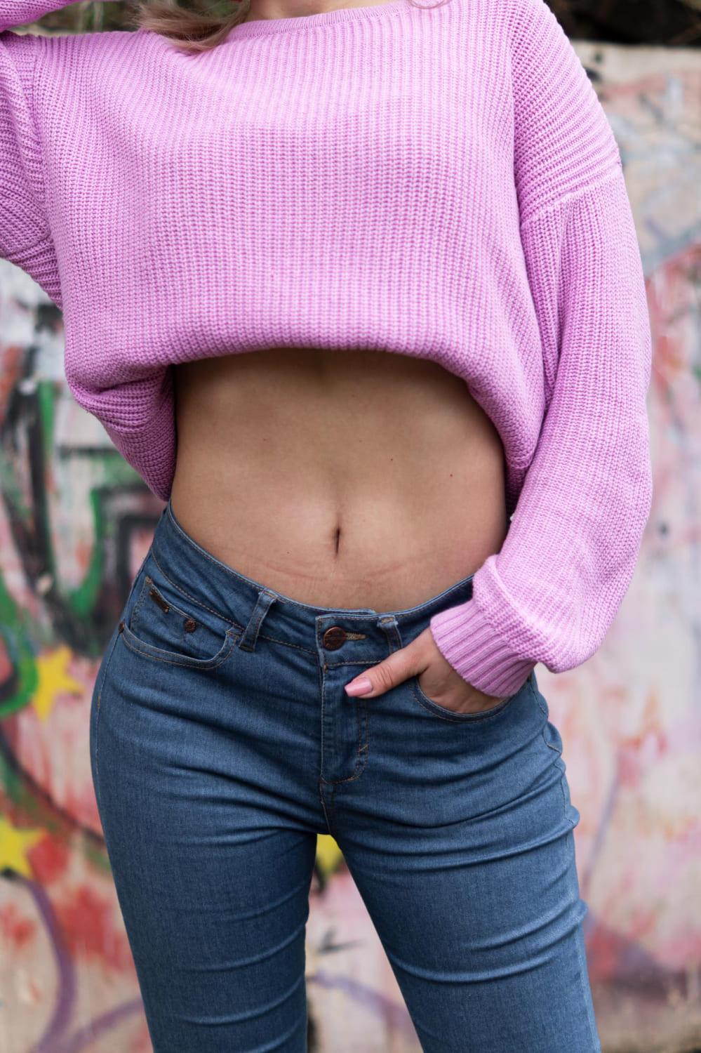 woman showing her belly button